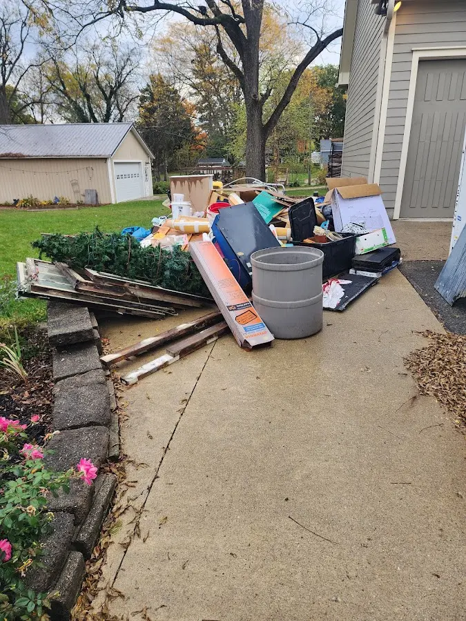 Dumpster being loaded with debris for 3 Yard Dumpster Rental in Montgomery